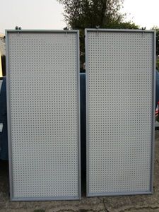 lot 130 image: Retail peg board w metal border and wheels