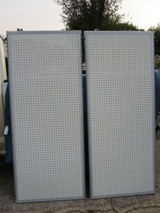lot 131 image: Retail peg board w metal border and wheels