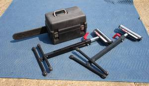 lot 141 image: Craftsman chainsaw with case, 2 rollerstands