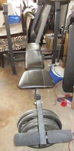 lot 147 image: Marcy weight bench, 45 lb bar and plates  310 pounds