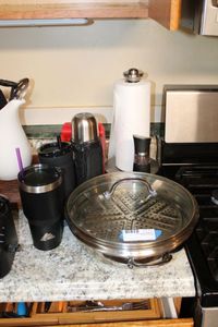 lot 28 image: Steamer Pan, Pepper Grind, Paper Towel Holder, Tumbler Travel Mugs, Mortar and Pestle, and Fat Trapper Bags