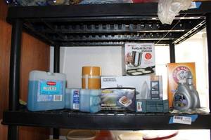 lot 46 image: Freezable Ice Packs, Battery Chargers, Baking Soda, Maytag Iron and More