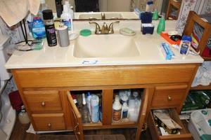 lot 66 image: Bathroom Items in and on Cabinet Soap, Cleaners, Toothpaste