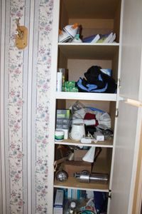lot 68 image: Contents of Bathroom Cabinet Soap Bars, Shower Handles, Pill Organizers, Depends, and More
