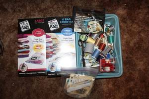 lot 87 image: Sewing ThreadButton, Traveling Sewing Kit, and  2 Original Space Bag Sets