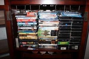 lot 99 image: DVD and VHS Movie Collection several VHS movies are unopened, see pictures