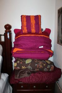 lot 108 image: Chic Home Design Pillow and Comforter Set, and Brown and Burgundy Color Blankets