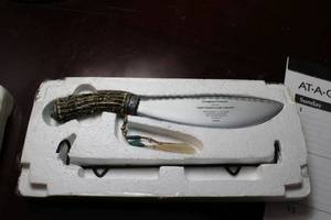 lot 125 image: Limited Edition Collectors Knife Marked Courageous Protector from the Loyal Warriors Knife Collection, Features Bone Handle, plastic blade with wolf design, and Turquoise Accents