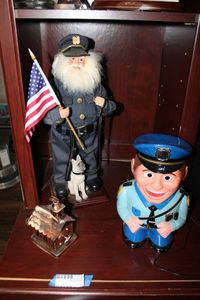 lot 177 image: Cookie Cop Talking Cookie Jar, Metal Church Music Box, K-9 and Cop Holding Flag Figurine