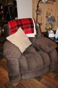 lot 162 image: Plush Rocking Recliner by Vietnam Oupeng Furniture Co. Plus Throw Blanket and Pillow