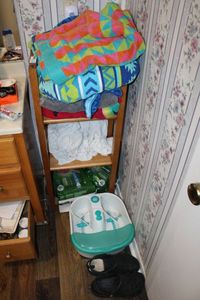 lot 65 image: Wooden Storage Unit, Bath Towels, Foot Soaker, Clogs and Depends
