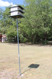 lot 370 image: Marlin Birdhouse on Pole cemented in ground PLEASE BRING TOOLS