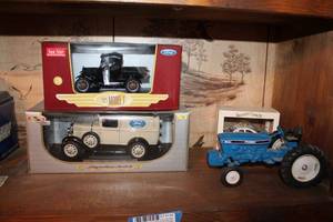 lot 139 image: Model Cars 1925 Ford Model T in Box (124), Ford Parts Truck (118), Ford Tractor, and Waterbury Clock Co. Timex Police Car in Box