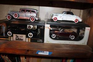 lot 141 image: Model Cars 1931 Peerless, The Godfather 40 Cadillac Fleetwood in Box, 1938 Buick Century Convertible Coupe, and 1941 Chevy Convertible