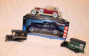lot 142 image: Model Cars 1932 Cadillac Sport, 1934 Cadillac V16 Aerodynamic Coupe, 2 US Mail Trucks