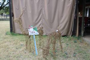 lot 214 image: Animated Lighted Christmas Deer (some lights not working) plus Let it Snow Yard Sign