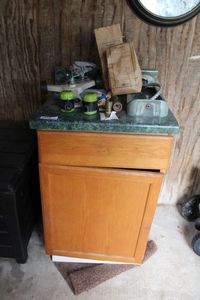 lot 211 image: Cabinet and Contents Variety of Sprinklers and 2 Bags of Gurneys Strawberry Food