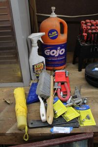 lot 249 image: Misc. Lot Gojo Hand Cleanser, Hand Brooms, Valve Caps, Air Compressor Attachments and Umbrella
