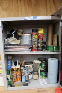 lot 243 image: Contents of Cabinet Flex Steel, Gorilla Glue, Duct Tape, Paint, and More