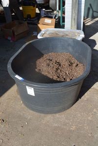 lot 356 image: LARGE Oval 40 Gallon Heavy Duty Tub with Potting Soil