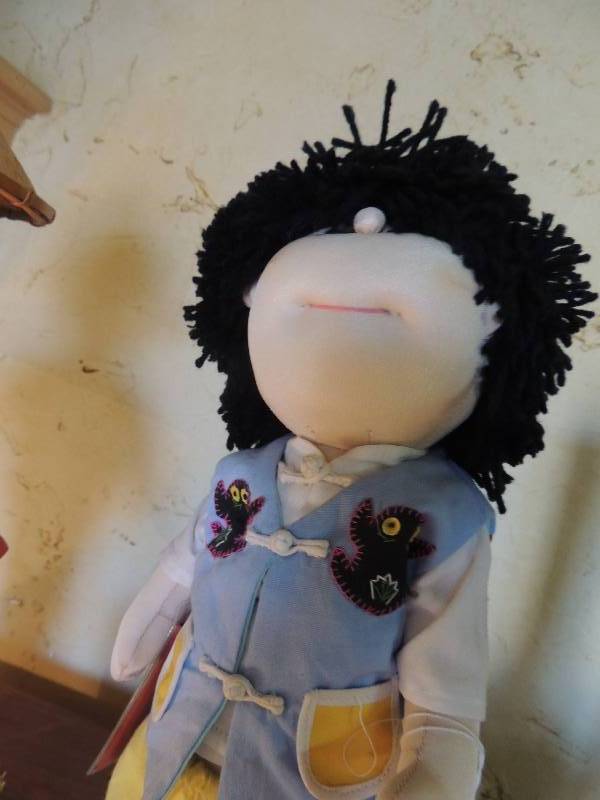 lot 49 image: 2 dolls - Unioncon Doll with Peoples Republic of China Passport and Asian Porcelain doll - both are 18