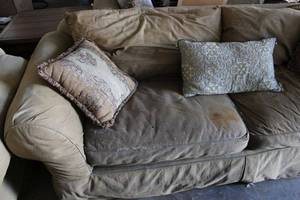lot 41 image: Tan Canvas Fabric Highly Durable Couch and Pillows as shown, needs Cleaned