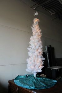 lot 77 image: Pre-Lit Aspen White Slim Tree 7 Ft. with Tree Skirt