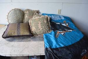 lot 131 image: Gold and Purple Throw Pillows, and NHL Sharks Sleeping Bag