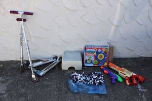 lot 184 image: Kids Lot Foam Dart Gun, Pom Poms, Pottery Wheel Set, and 2 Razor Scooters