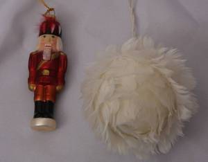 lot 108 image: Lot of 2 Christmas Ornaments  Feather Ball and Nutcracker  Glass