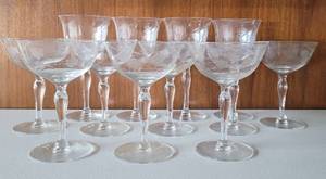 lot 9 image: LOT OF 12 VINTAGE ETCHED GLASS STEMWARE. ONE SHOWS A SMALL CHIP.