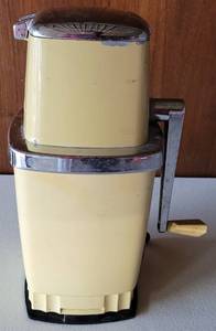 lot 10 image: VINTAGE MID-CENTURY SWING-A-WAY HAND CRANK ICE CRUSHER IN STYLE, COLOR, AND CONDITION SHOWN.