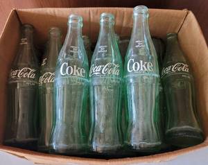 lot 36 image: LOT OF 25 VINTAGE 10 OUNCE COCA-COLA BOTTLES AS SHOWN.