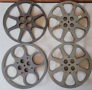 lot 48 image: LOT OF 4 VINTAGE METAL MOVIE REELS AS SHOWN. EACH APPROX. 12 DIAMETER. (SOLD 4X THE MONEY)