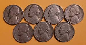 lot 58 image: LOT OF 7 VINTAGE NICKEL COINS INCLUDING 1940S, 1950S, AND 1960S. (SOLD 7X THE MONEY)