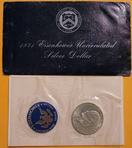 lot 62 image: 1971 EISENHOWER UNCIRCULATED SILVER DOLLAR IN SEALED PACKAGE AS SHOWN.