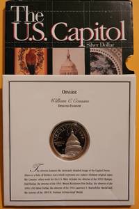 lot 64 image: 1994 U.S. CAPITOL SILVER DOLLAR PROOF COIN IN COMMEMORATIVE INFORMATIONAL BOX AS SHOWN.