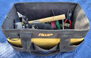 lot 75 image: AWP TOOL TOTEBAG WITH CONTENTS INCLUDING ASSORTED TOOLS, HARDWARE, AND MORE AS SHOWN.