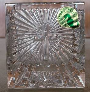 lot 104 image: WATERFORD CRYSTAL SQUARE VOTIVE CANDLE HOLDER WITH ORIGINAL LABEL. APPROX 2.75W x 2.75H. HAS IMAGE OF HEART AND 2000 A.D. ETCHED ON BOTTOM WITH WATERFORD MARK AS SHOWN.