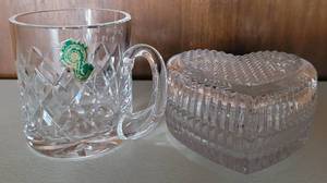 lot 113 image: WATERFORD CRYSTAL HANDLED COFFEE CUP (with monogram) AND ORIG. WATERFORD LABEL 3H. ALSO INCLUDES A STUDIO NOVA CHECKERBOARD LIDDED TRINKET BOX IN HEART FORM WITH ORIGINAL LABEL AS SHOWN.
