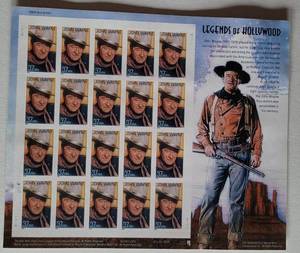 lot 143 image: 2004 UNUSED JOHN WAYNE STAMPS SHEET AS SHOWN.
