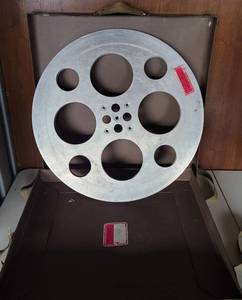 lot 157 image: LARGE SIZE VINTAGE ALUMINUM MOVIE REEL WITH SHIPPING BOX AS SHOWN. CHECK IT OUT