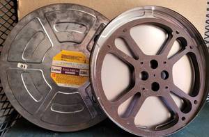 lot 200 image: LOT OF 2 VINTAGE METAL MOVIE REELS WITH CANSCASES AS SHOWN. (SOLD 2X THE MONEY)