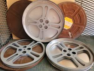 lot 209 image: LOT OF 3 VINTAGE METAL MOVIE REELS WITH CANSCASES AS SHOWN. (SOLD 3X THE MONEY)