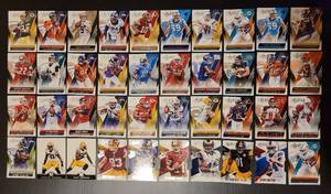 lot 91 image: LOT OF FOOTBALL CARDS INCLUDING AARON RODGERS, PEYTON MANNING, DREW BREES, DEMARCUS WARE, ROBERT GRIFFIN lll, PHILLIP RIVERS, CALVIN JOHNSON, LUKE KUECHLY, AND MORE AS SHOWN.