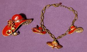 lot 220 image: 2004 AVON FANCY HAT CHARM BRACELET AND BROOCH SET AS SHOWN.
