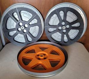 lot 241 image: LOT OF 3 VINTAGE MOVIE REELS WITH CANSCASES AS SHOWN. (SOLD 3X THE MONEY)
