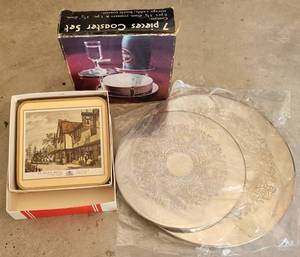 lot 257 image: LOT OF COASTERS AND TRIVETS INCLUDING SILVER PLATE AS SHOWN.