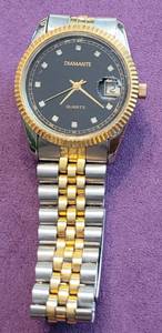 lot 277 image: DIAMANTE QUARTZ MENS WRIST WATCH IN GOLD AND SILVER TONE AS SHOWN.