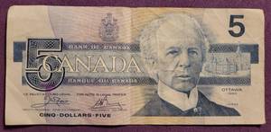 lot 290 image: 1986 CANADIAN 5 DOLLAR BILL AS SHOWN.